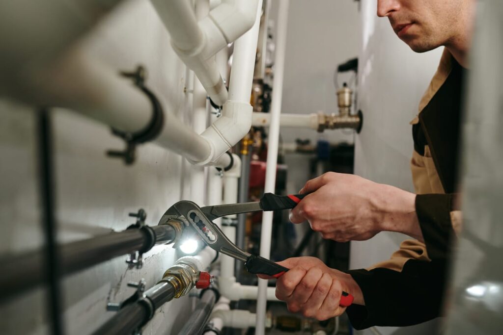 Plumbers maintaining commercial plumbing pipes in Murrieta